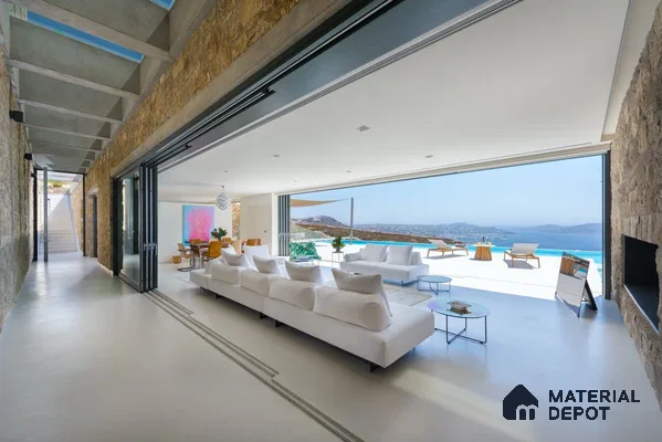 a bathroom with a large tub in the middle of the room and two windows overlooking the city at night time area, next to a window filled with lots of the city at night time Happy House, Cool Tech,